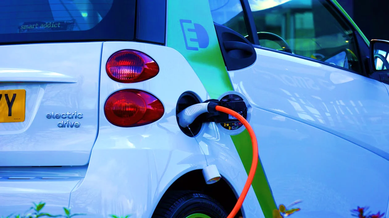 Electric vehicle connected to a charging point